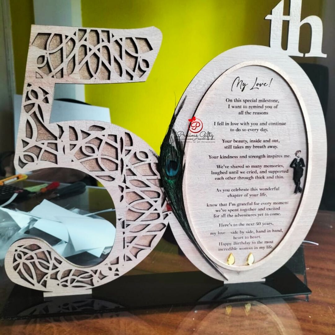 Laser-cut wooden 50th birthday number card with peacock feather