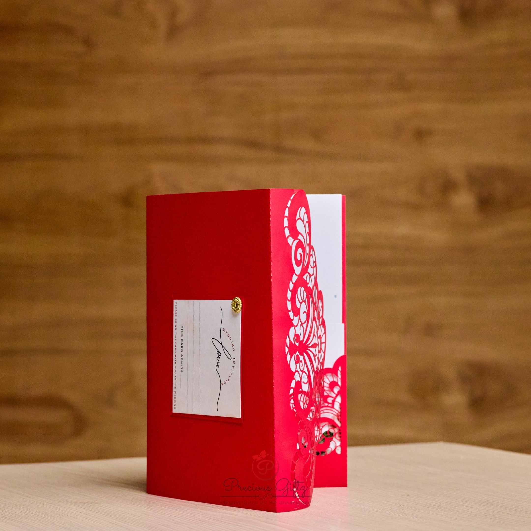 Red laser-cut floral wedding invitation with admit card